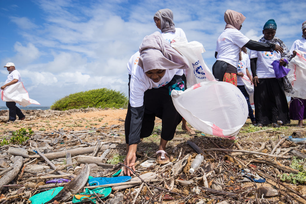 Ocean Sole team collecting beach trash on Kenyan Beaches during International Beach Cleanup Day.