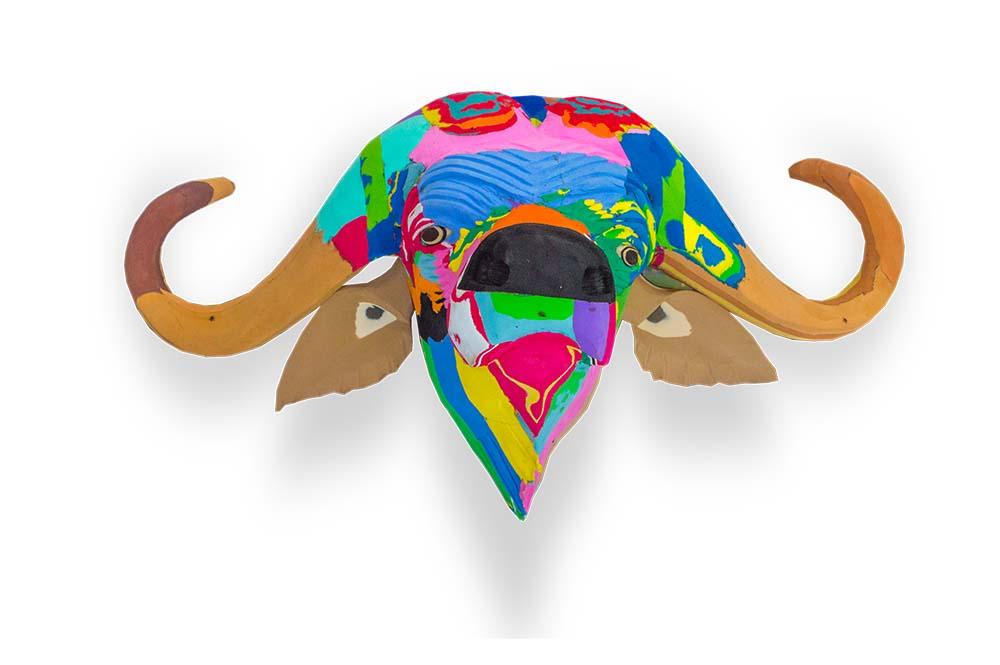 Hand-carved multicolored buffalo wall art sculpture made of upcycled flip flops by Ocean Sole designed to hang on your wall.