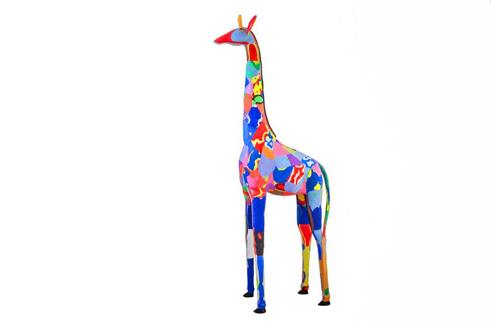 Hand-carved multicolored giraffe sculpture made of upcycled flip flops by Ocean Sole.