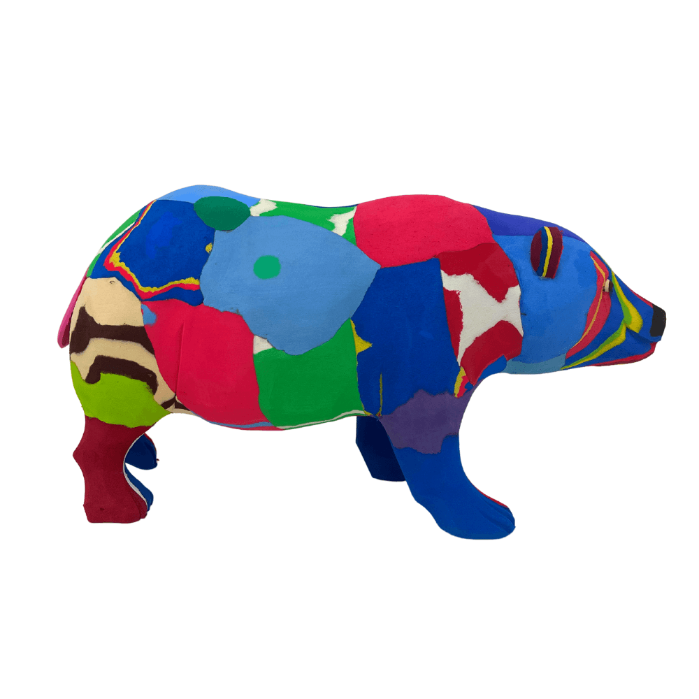 Hand-carved multicolored polar bear sculpture made of upcycled flip flops by Ocean Sole.