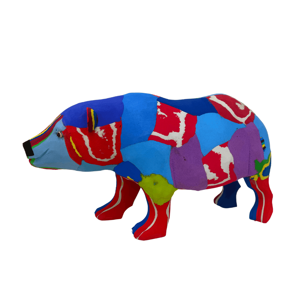 Hand-carved multicolored polar bear sculpture made of upcycled flip flops by Ocean Sole.