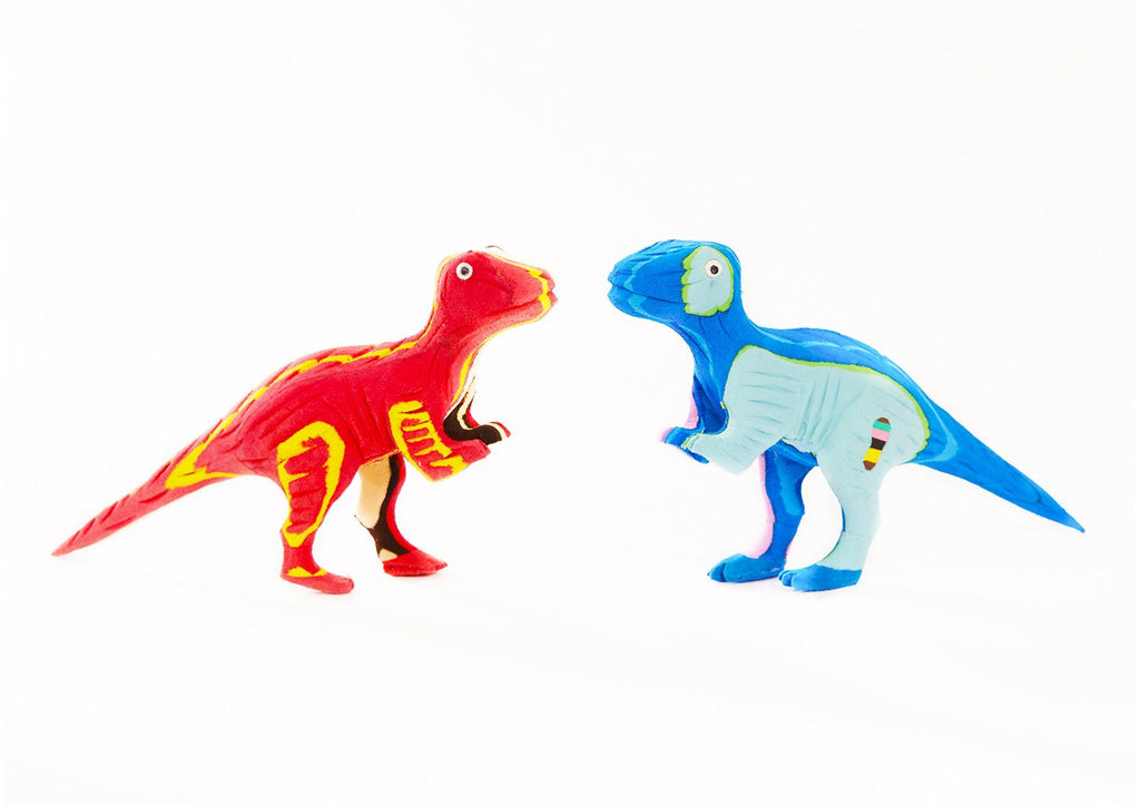 Two hand-carved multicolored T-Rex sculpture made of upcycled flip flops by Ocean Sole.