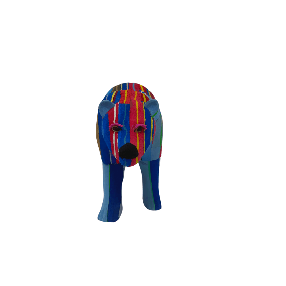 Hand-carved multicolored polar bear sculpture made of upcycled flip flops by Ocean Sole.