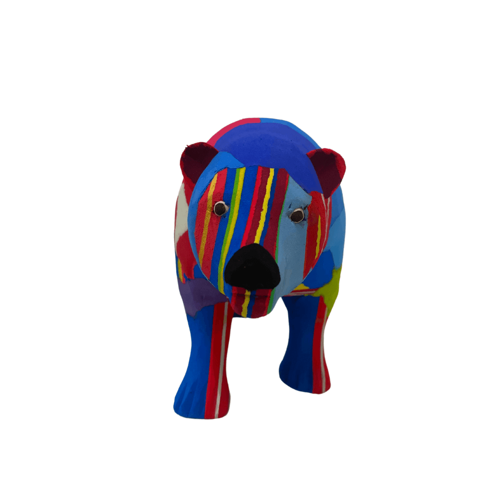 Hand-carved multicolored polar bear sculpture made of upcycled flip flops by Ocean Sole.