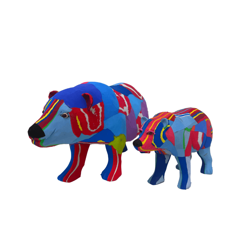 Two hand-carved multicolored polar bear sculpture made of upcycled flip flops by Ocean Sole.