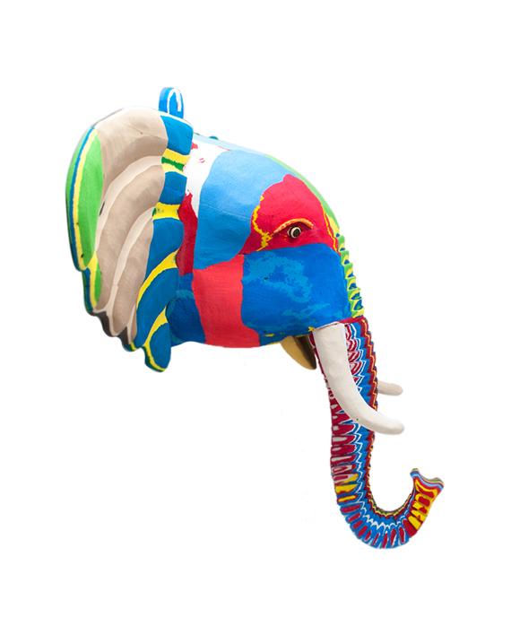 Hand-carved multicolored elephant wall art sculpture made of upcycled flip flops by Ocean Sole designed to hang on your wall.