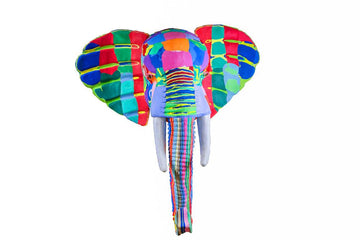 Hand-carved multicolored elephant wall art sculpture made of upcycled flip flops by Ocean Sole designed to hang on your wall.