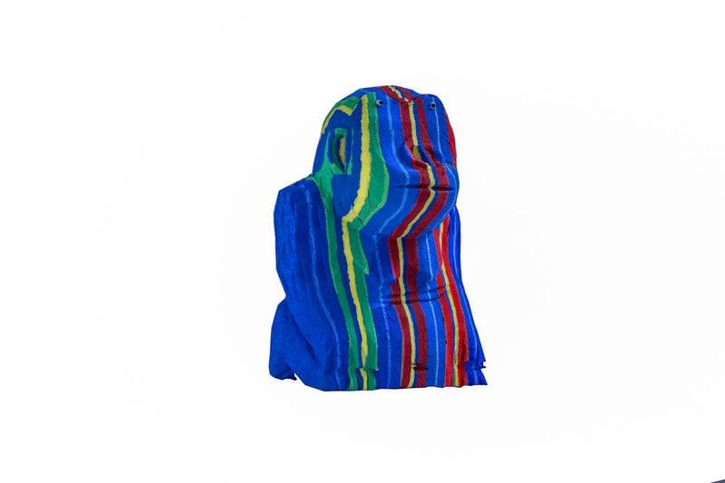 Hand-carved multicolored sitting gorilla sculpture made of upcycled flip flops by Ocean Sole.