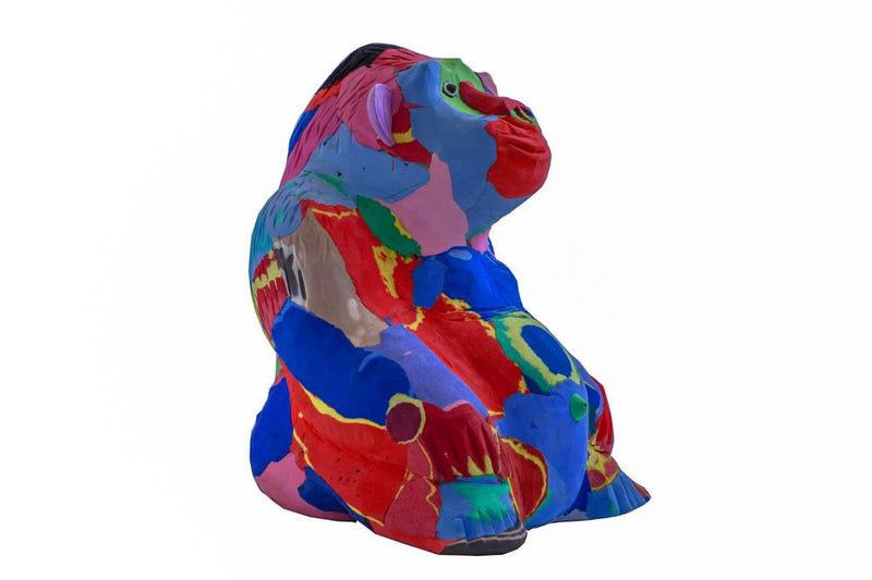 Hand-carved multicolored sitting gorilla sculpture made of upcycled flip flops by Ocean Sole.