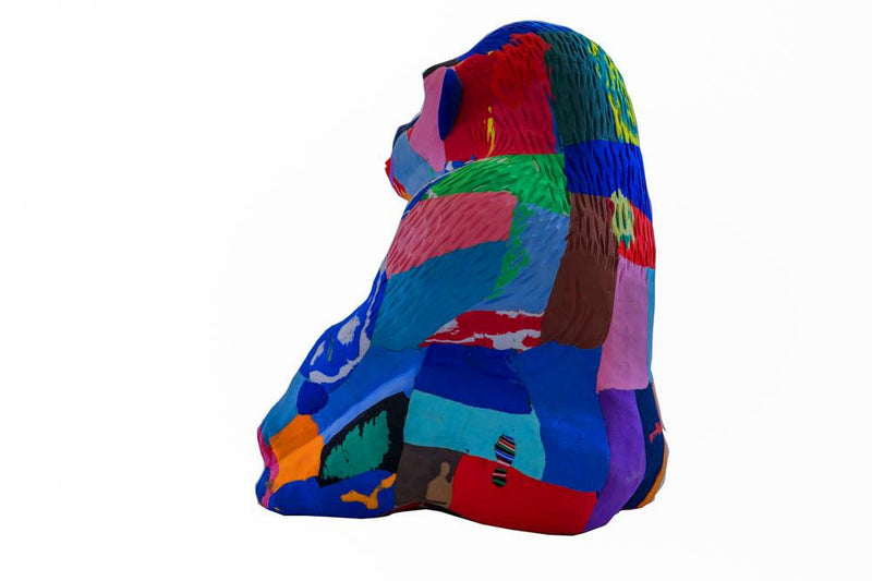 Hand-carved multicolored sitting gorilla sculpture made of upcycled flip flops by Ocean Sole.