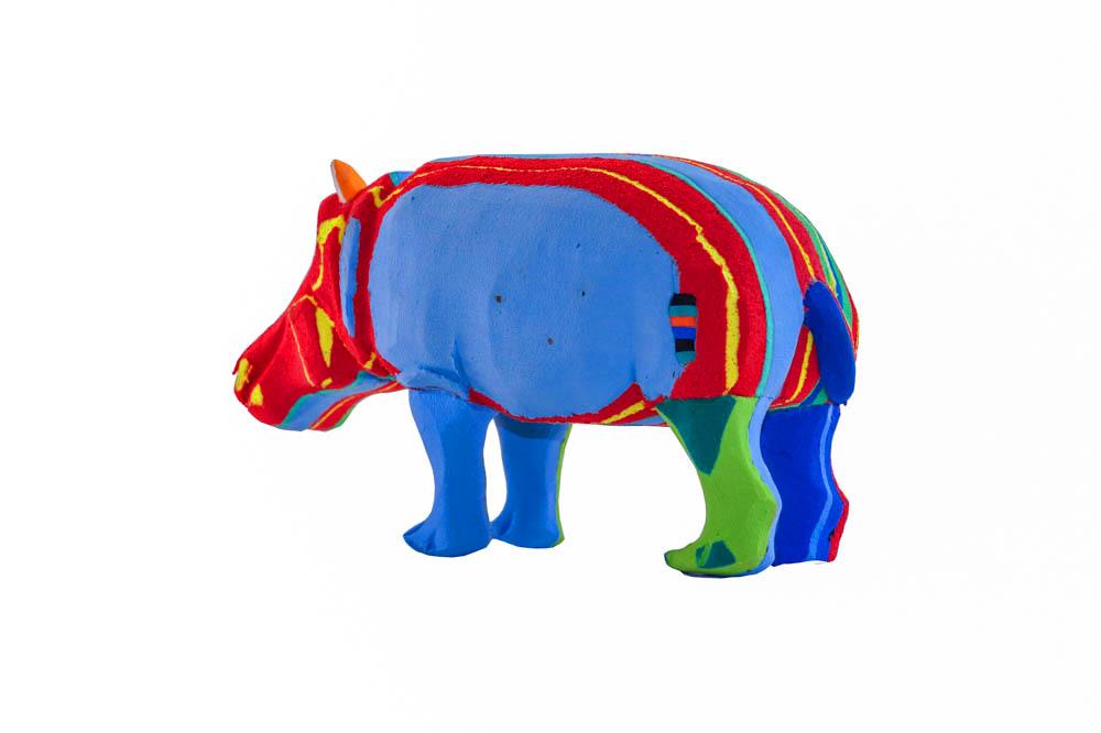 Hand-carved multicolored hippo sculpture made of upcycled flip flops by Ocean Sole.