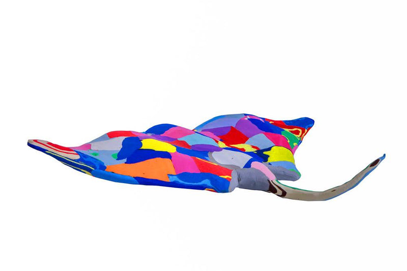 Hand-carved multicolored manta ray sculpture made of upcycled flip flops by Ocean Sole.