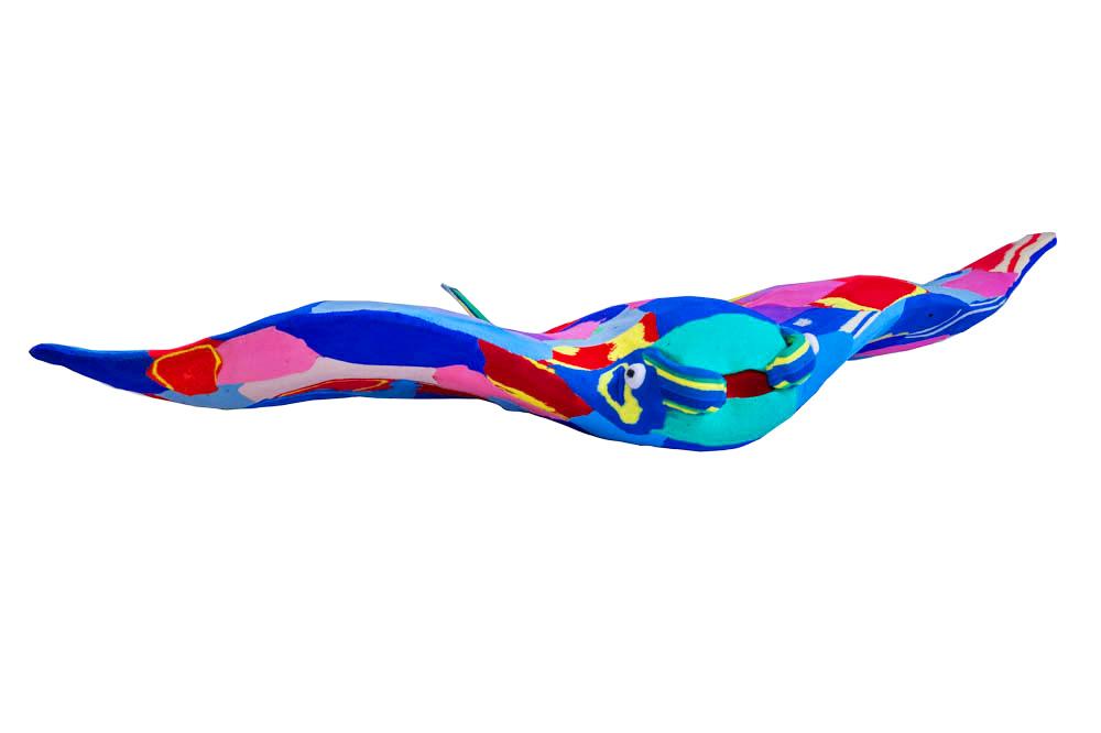 Hand-carved multicolored manta ray sculpture made of upcycled flip flops by Ocean Sole.