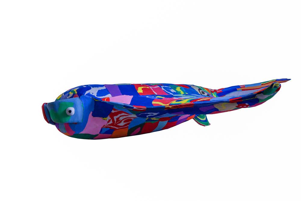 Hand-carved multicolored manta ray sculpture made of upcycled flip flops by Ocean Sole.