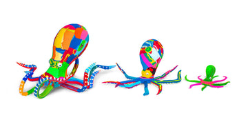 Three hand-carved multicolored octopus sculptures made of upcycled flip flops by Ocean Sole lined up in size comparison.