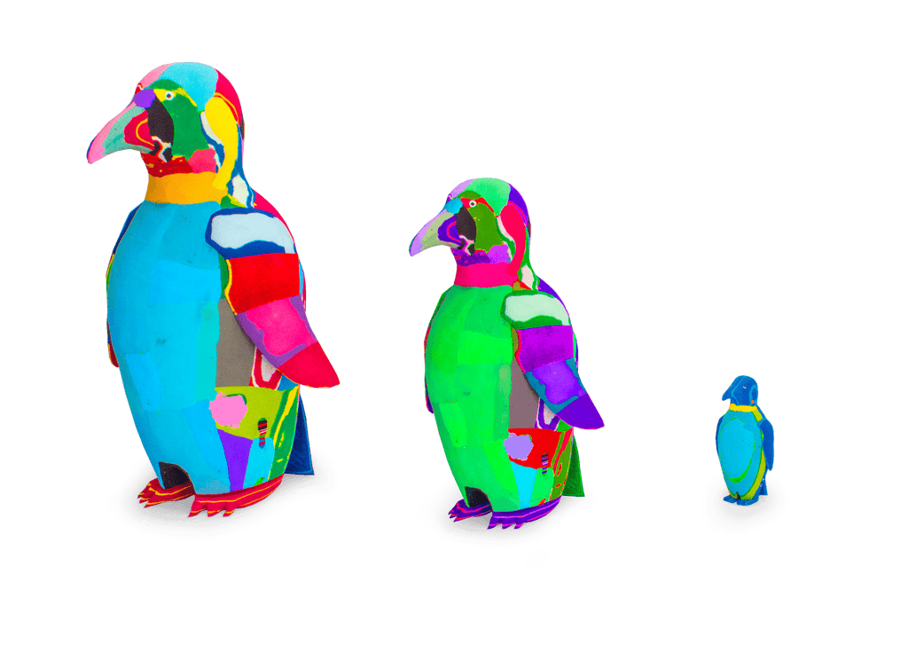 Three hand-carved multicolored penguin sculptures made of upcycled flip flops by Ocean Sole lined up in size comparison.