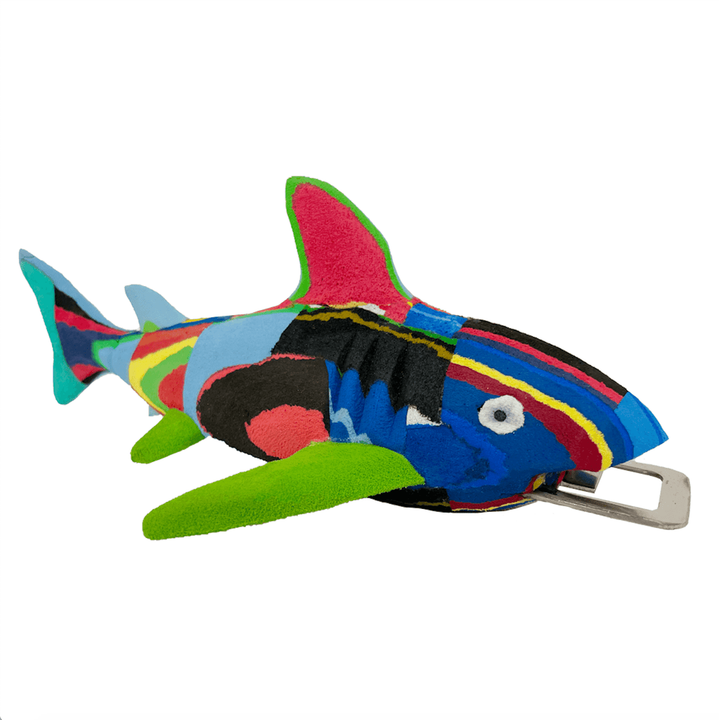 Hand-carved multicolored shark bottle opener made of upcycled flip flops by Ocean Sole.