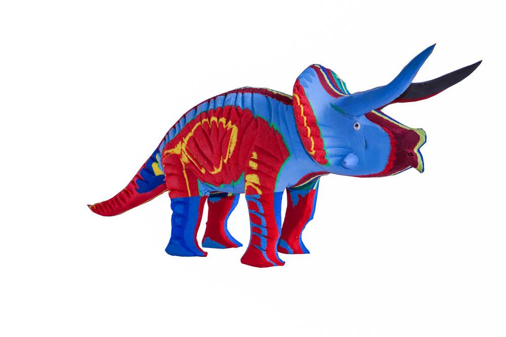 Hand-carved multicolored triceratops sculpture made of upcycled flip flops by Ocean Sole.