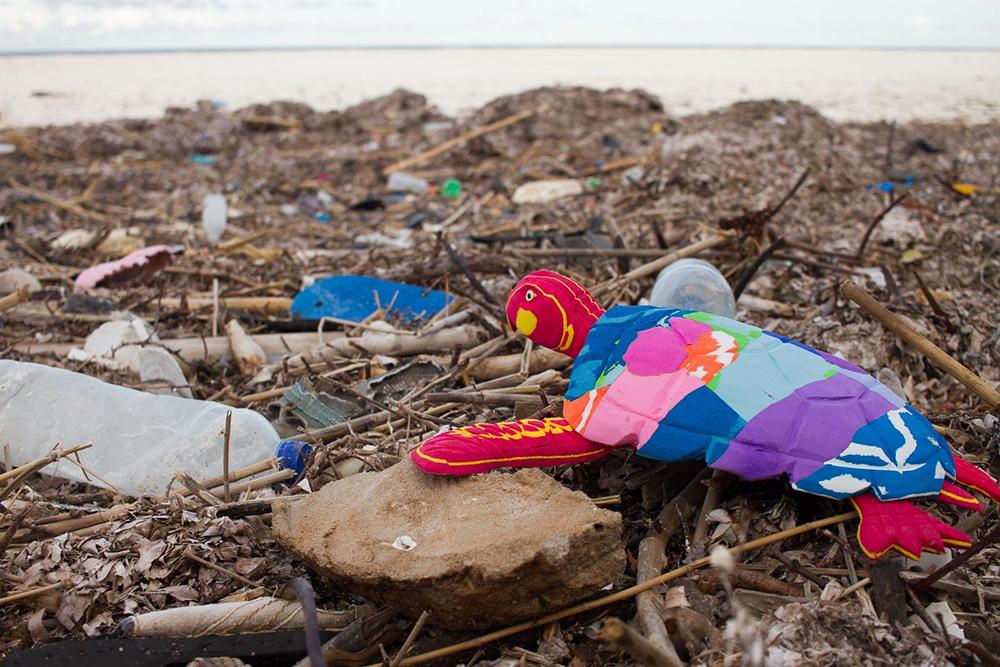 Hand-carved multicolored turtle sculpture made of upcycled flip flops by Ocean Sole.