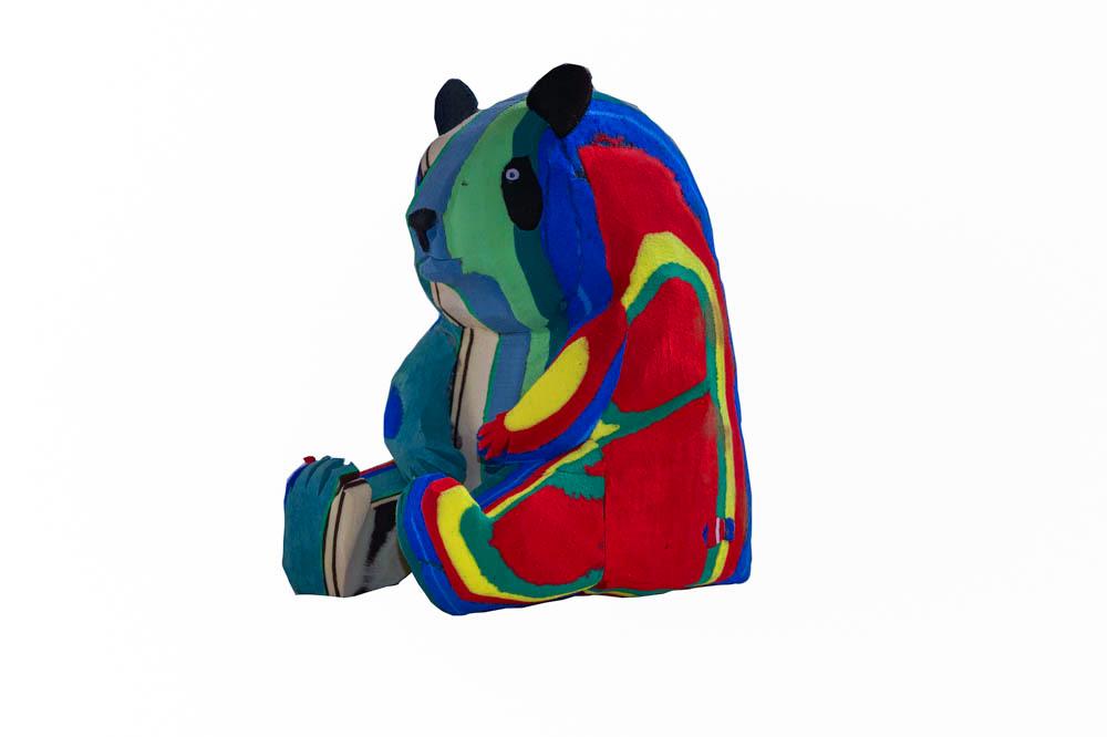 Hand-carved multicolored panda sculpture made of upcycled flip flops by Ocean Sole.