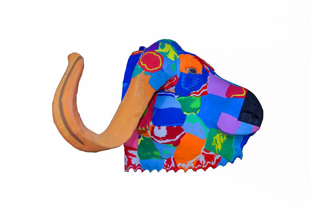 Hand-carved multicolored buffalo wall art sculpture made of upcycled flip flops by Ocean Sole designed to hang on your wall.