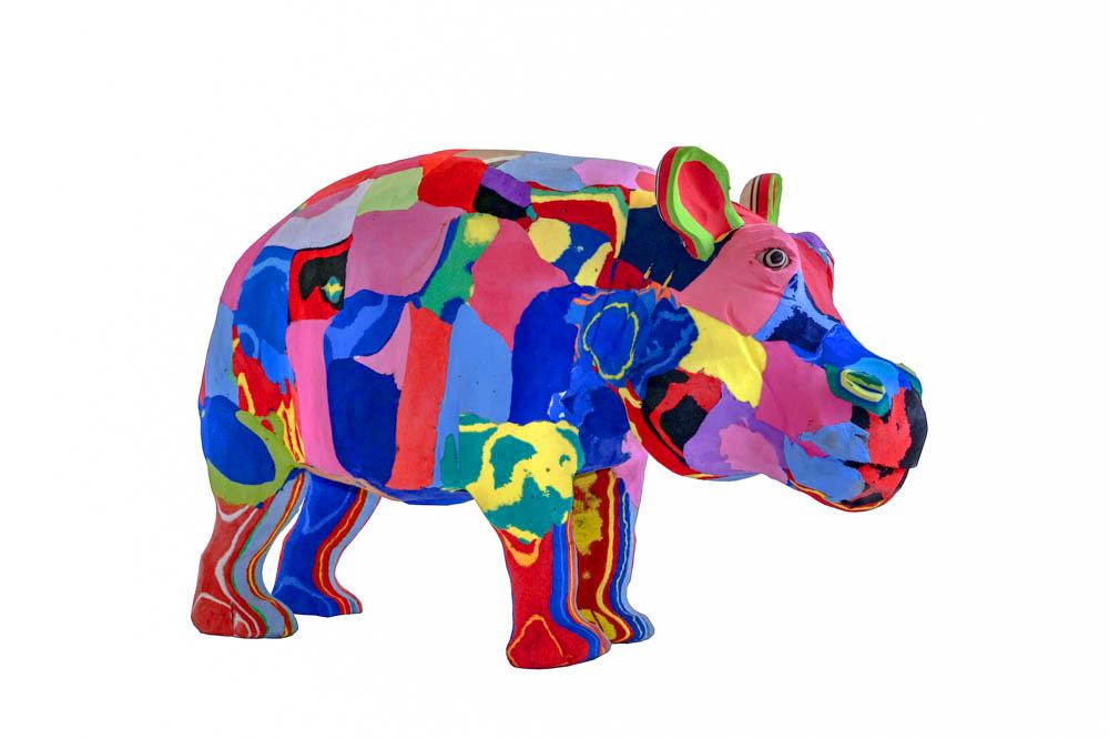 Hand-carved multicolored hippo sculpture made of upcycled flip flops by Ocean Sole.