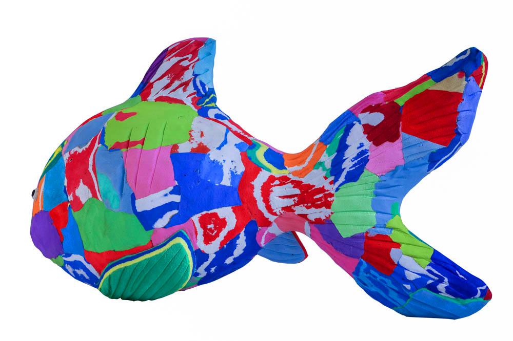 Hand-carved multicolored reef fish sculpture made of upcycled flip flops by Ocean Sole.