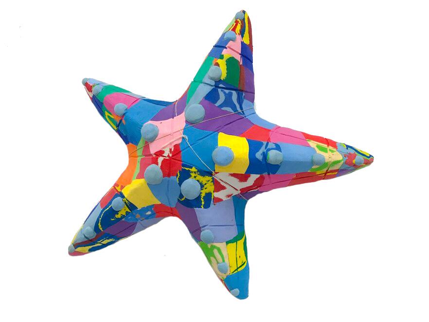 Hand-carved multicolored starfish sculpture made of upcycled flip flops by Ocean Sole.