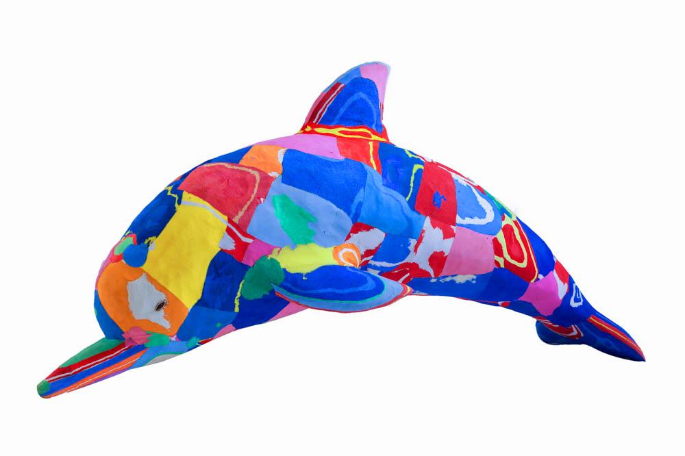 Hand-carved multicolored dolphin sculpture made of upcycled flip flops by Ocean Sole.