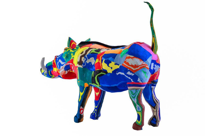 Hand-carved multicolored warthog sculpture made of upcycled flip flops by Ocean Sole.