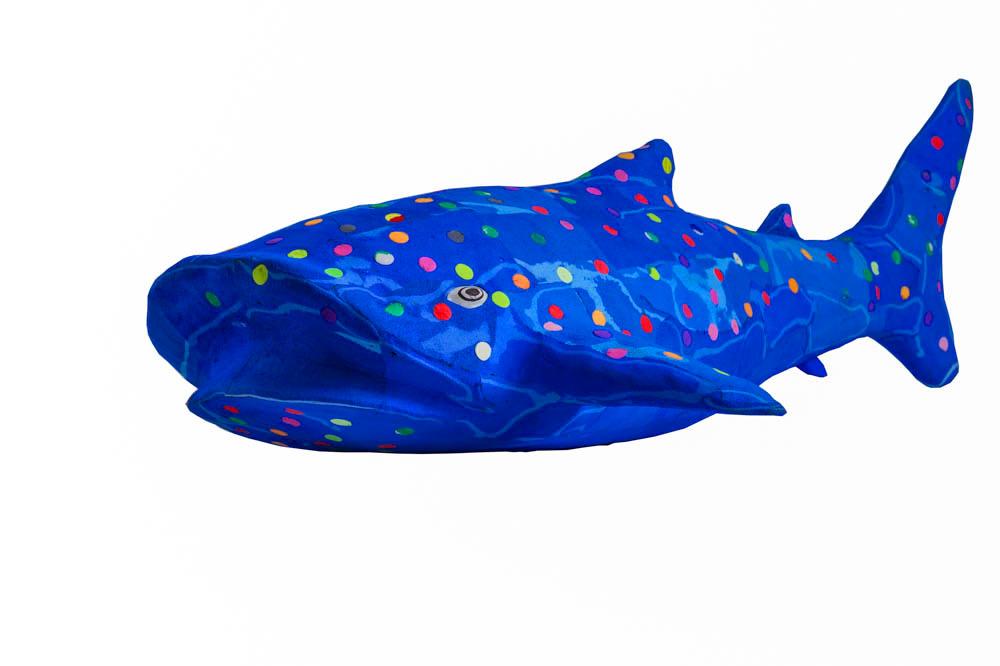Hand-carved multicolored alligator sculpture made of upcycled flip flops by Ocean Sole.