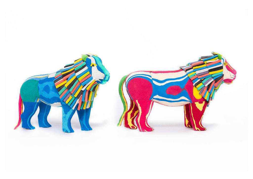 Two hand-carved multicolored standing lion sculpture made of upcycled flip flops by Ocean Sole.