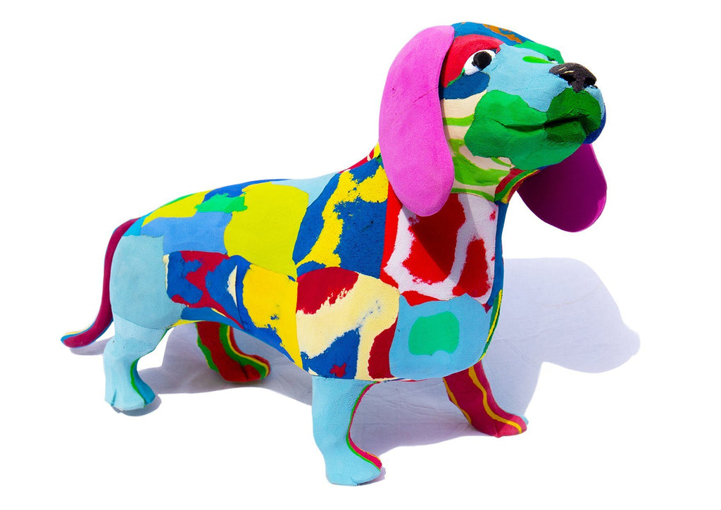 Hand-carved multicolored sausage dog sculpture made of upcycled flip flops by Ocean Sole.