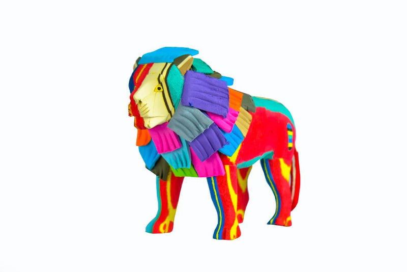 Hand-carved multicolored standing lion sculpture made of upcycled flip flops by Ocean Sole.
