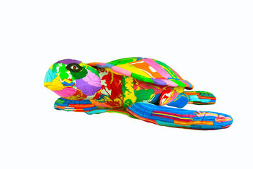 Large hand-carved multicolored turtle sculpture made of upcycled flip flops by Ocean Sole.